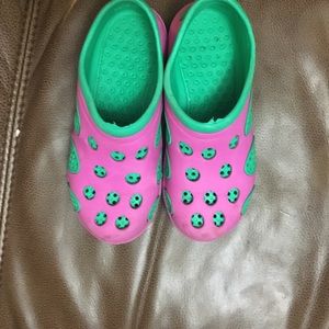 Pink and green croc like shoes